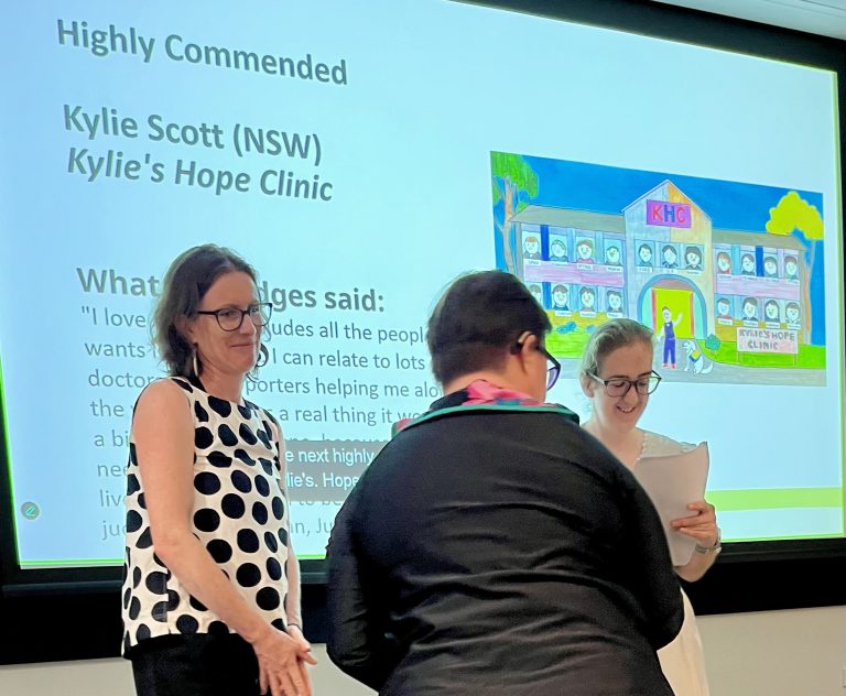 Kylie receiving award